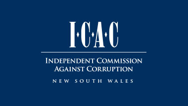 white NSW ICAC logo on dark blue background